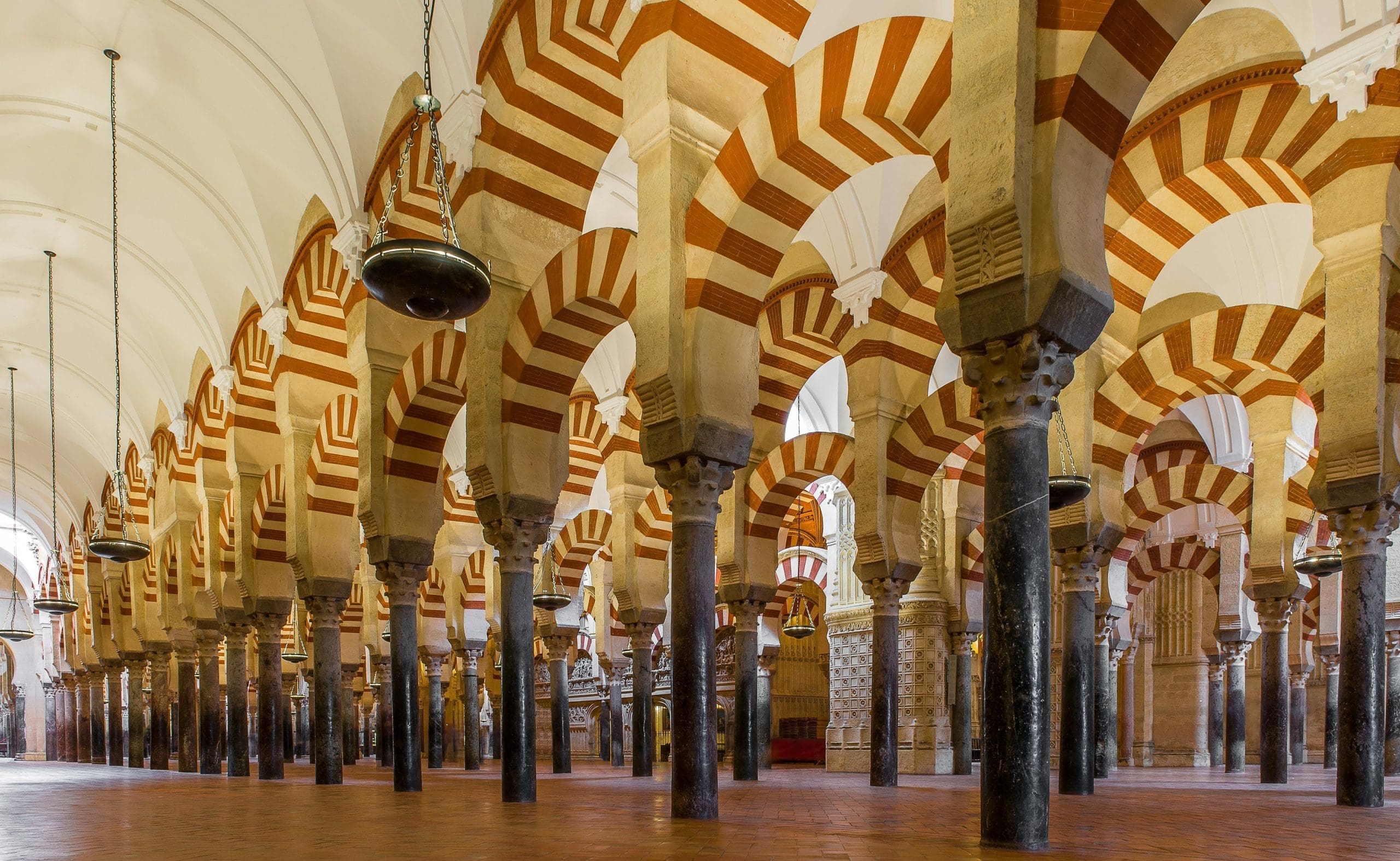 Arches within the historic Mosque-Cathedral of Córdoba, showcasing Islamic architecture.